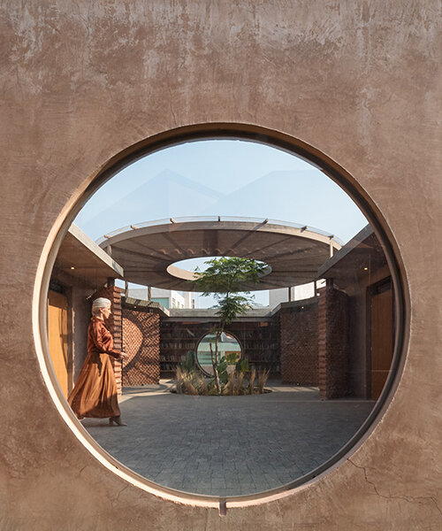 opposite circular openings offer visual connection through 'casa UC' in mexico
