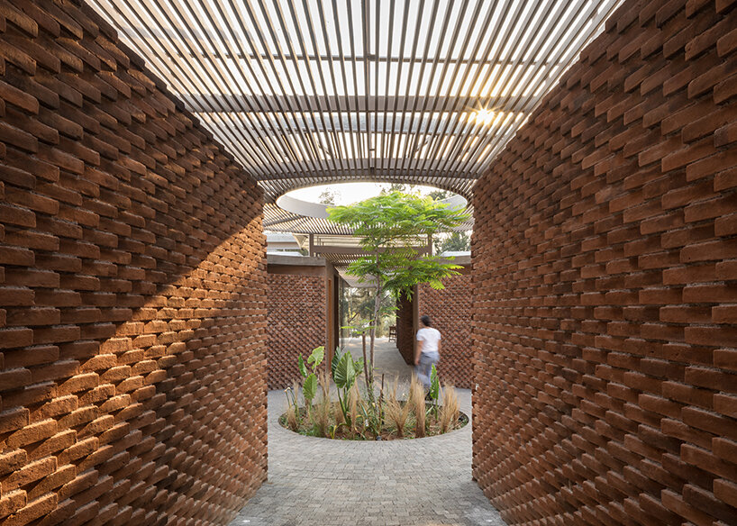 opposite circular openings offer visual connection through 'casa UC' in mexico
