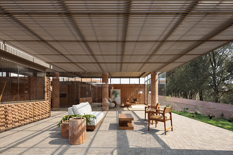 opposite circular openings offer visual connection through 'casa UC' in mexico