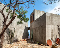 two rotated concrete volumes look for sunrise and sunset at mexican 'casa del sapo'