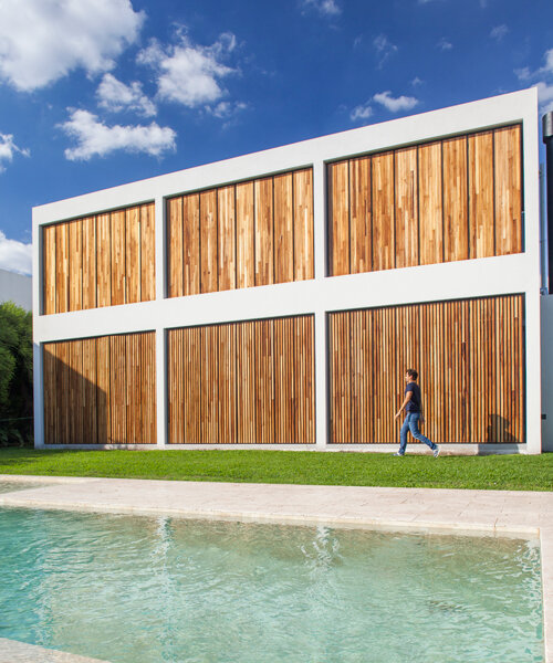 estudio PKa defines its casa M&M in buenos aires with a grid of massive timber shutters