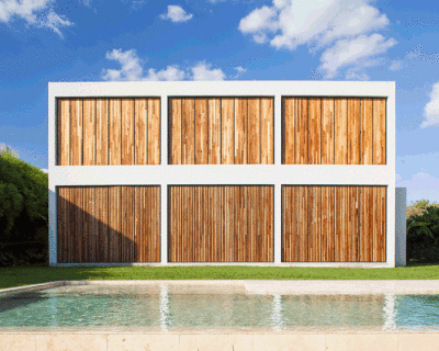 estudio PKa defines its casa M&M in buenos aires with a grid of massive timber shutters