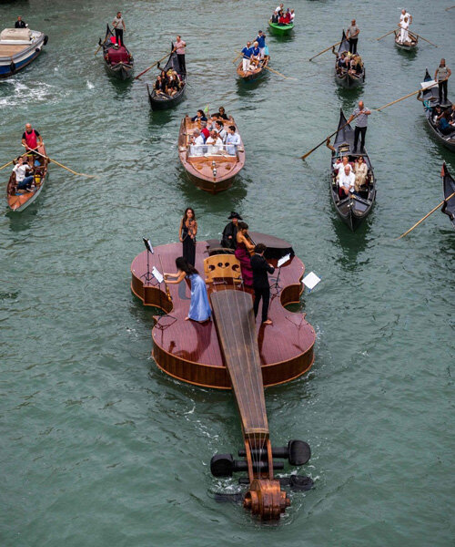 giant violin floats down venice's grand canal complete with string quartet