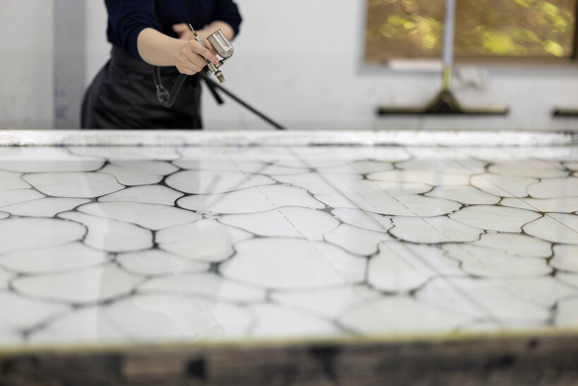 issey miyake exhibits traditional japanese ‘ink marbling’ technique at kyoto flagship store