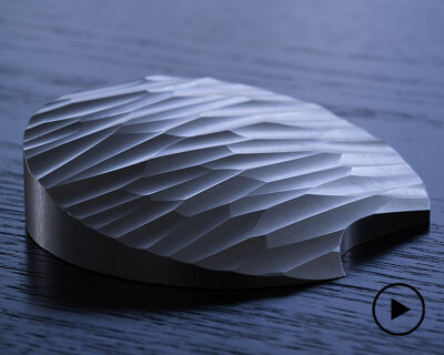 ancient stone tools inform AATISMO's carved aluminum package opener