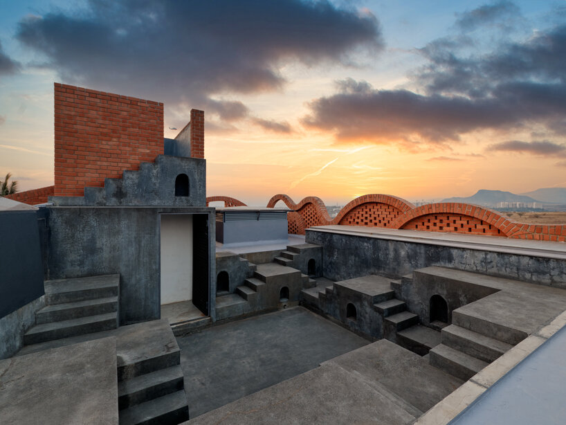 curved red bricks crown a family home in india designed by PMA madhushala