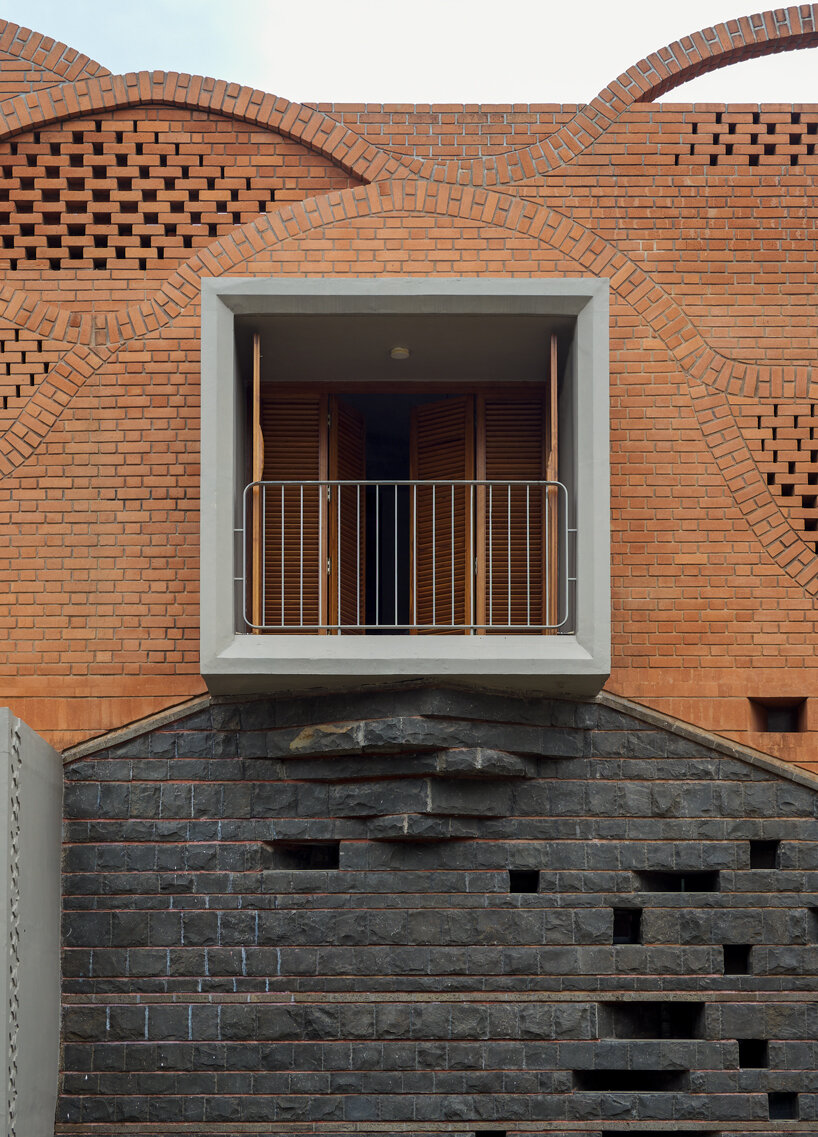 curved red bricks crown a family home in india designed by PMA madhushala