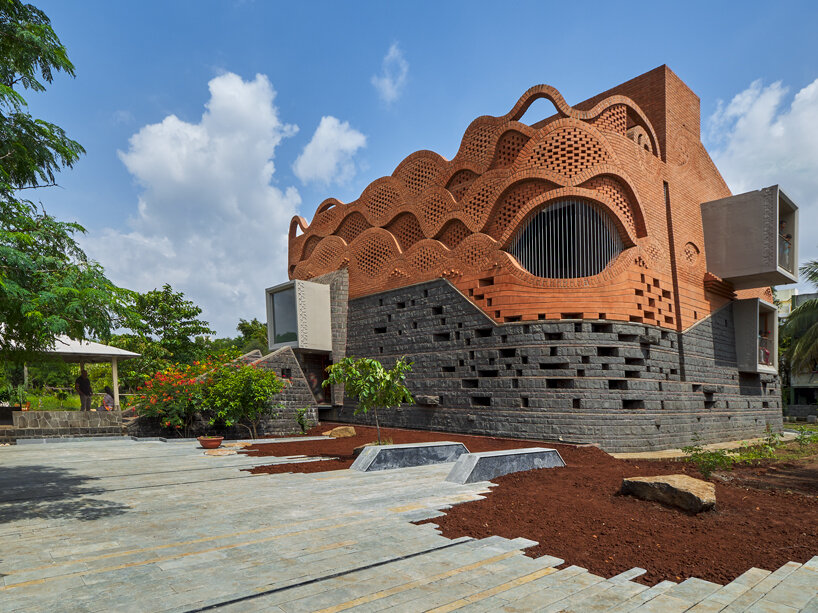 curved red bricks crown a family home in india designed by PMA madhushala