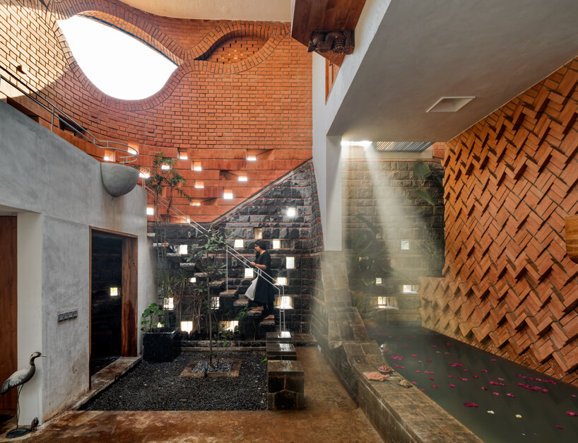 curved red bricks crown a family home in india designed by PMA madhushala