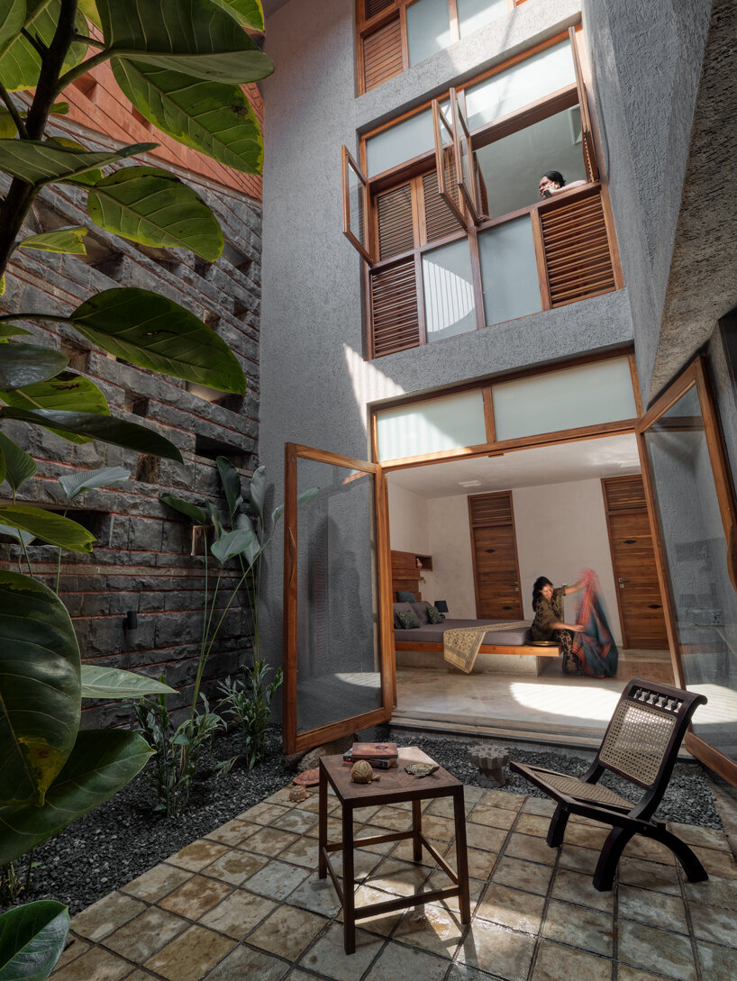 curved red bricks crown a family home in india designed by PMA madhushala