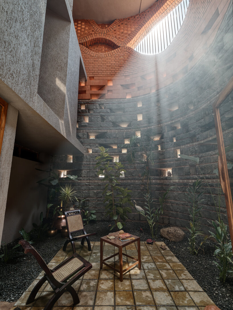 curved red bricks crown a family home in india designed by PMA madhushala