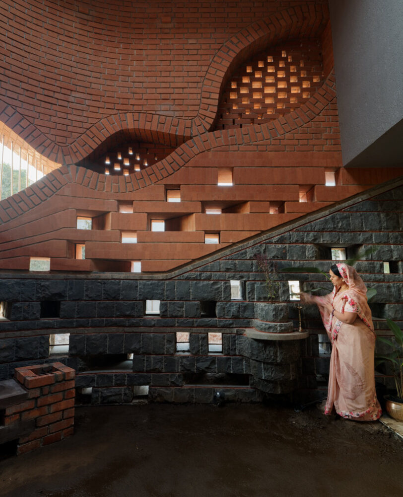 curved red bricks crown a family home in india designed by PMA madhushala