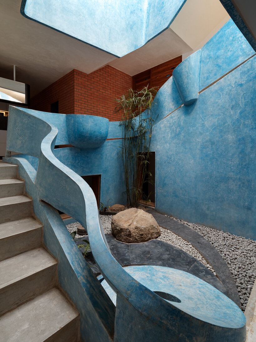 curved red bricks crown a family home in india designed by PMA madhushala
