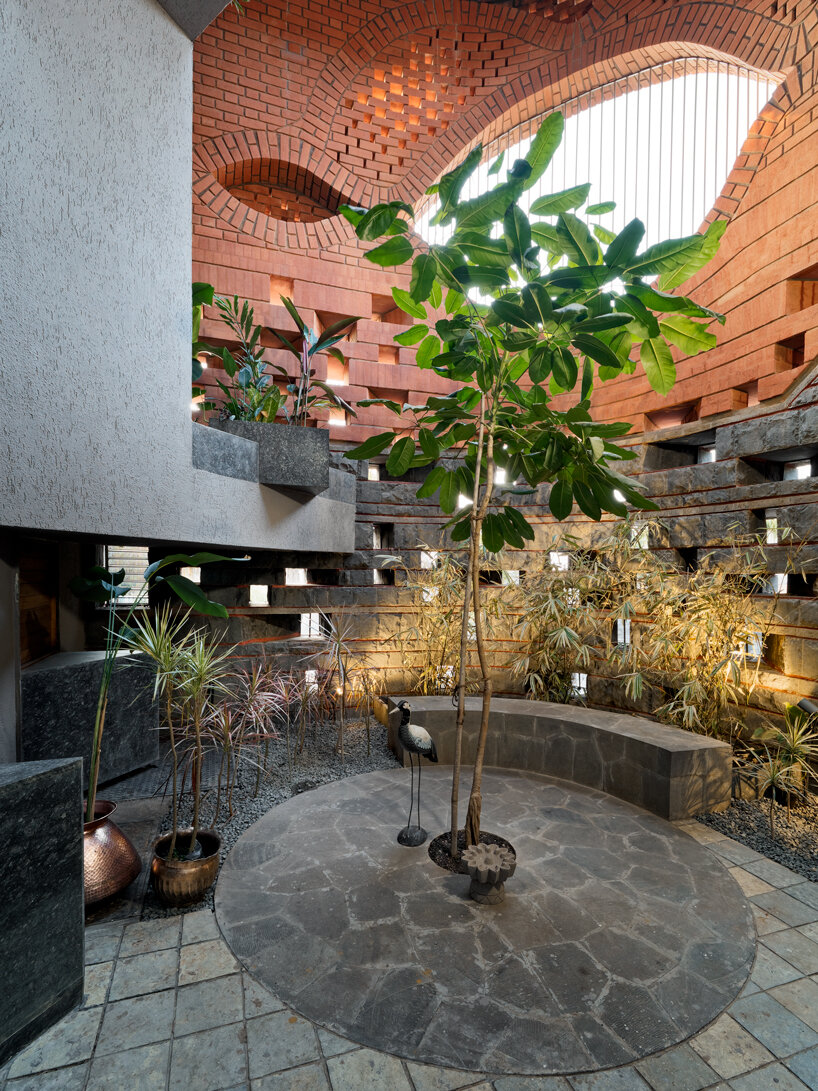 curved red bricks crown a family home in india designed by PMA madhushala