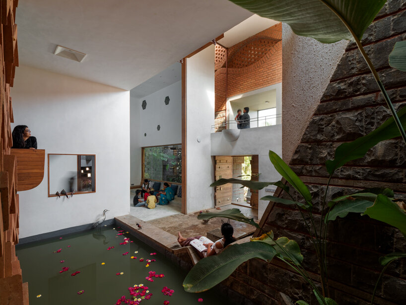 curved red bricks crown a family home in india designed by PMA madhushala