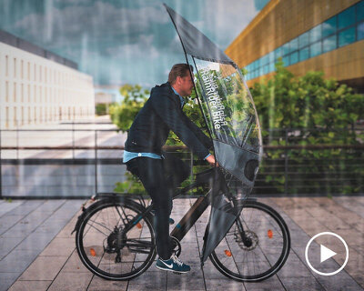 rainrider designs a lightweight cover to protect cyclists from bad weather