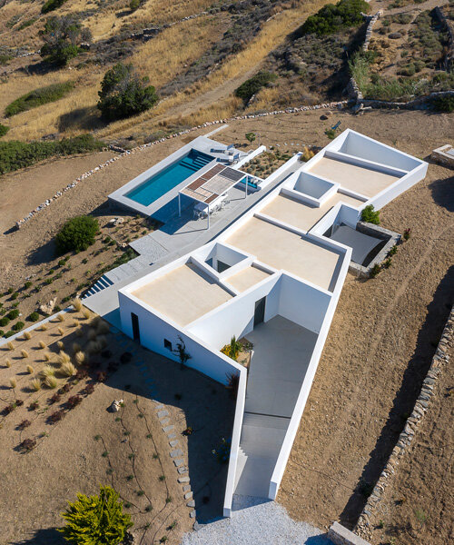 react architects embeds 'the nest' house into the natural landscape of paros, greece