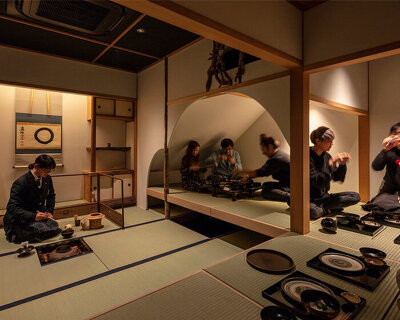 elevated teahouse interior in tokyo morphs traditional japanese- into western-style