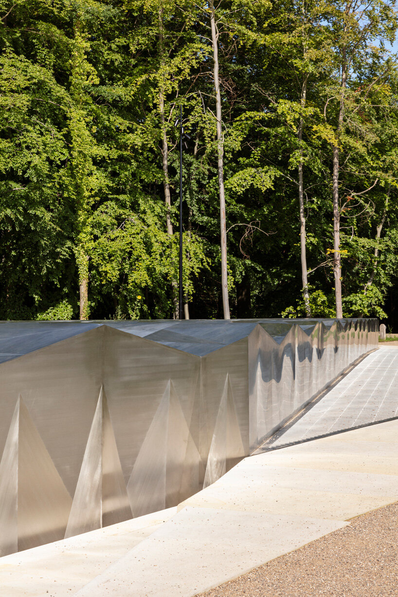 snøhetta tops subterranean museum extension with a faceted steel structure in denmark