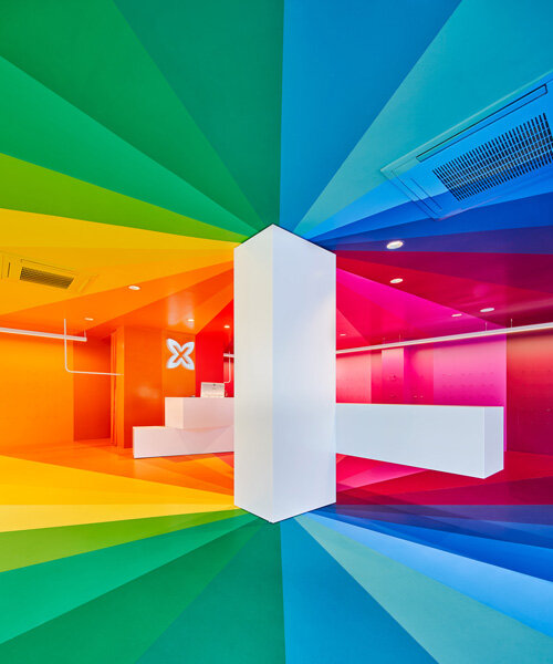 a color explosion: studio animal completes rainbow-hued store in barcelona