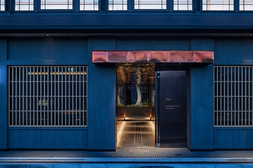 narrow copper box leads the guests into the quiet kyoto hotel through the alleged design office