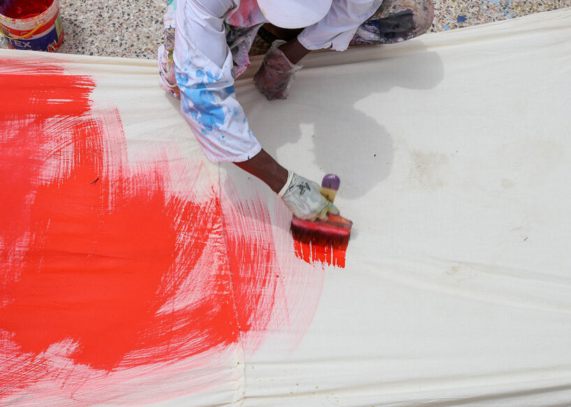 the slum studio is turning clothing waste into hand-painted apparel designboom