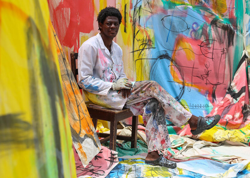 the slum studio is turning clothing waste into hand-painted apparel designboom