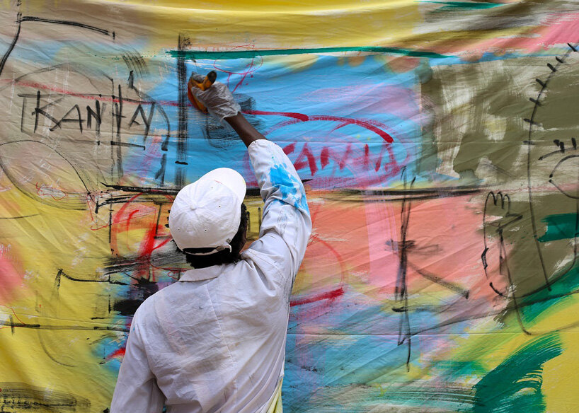 the slum studio is turning clothing waste into hand-painted apparel designboom