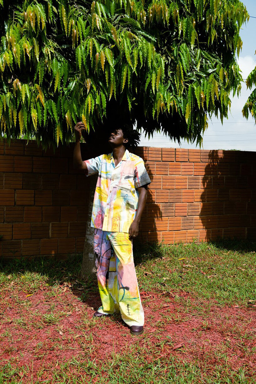 the slum studio is turning clothing waste into hand-painted apparel designboom