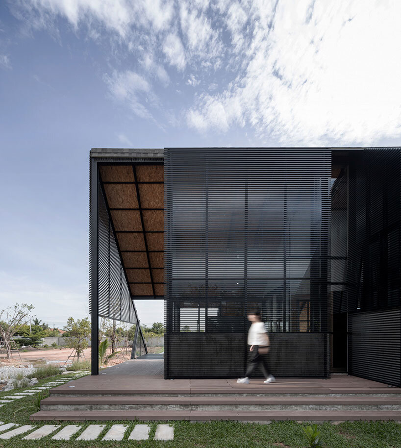 the sloping roof of TOUCH architect's 'villa backyard' directs rainwater in thailand