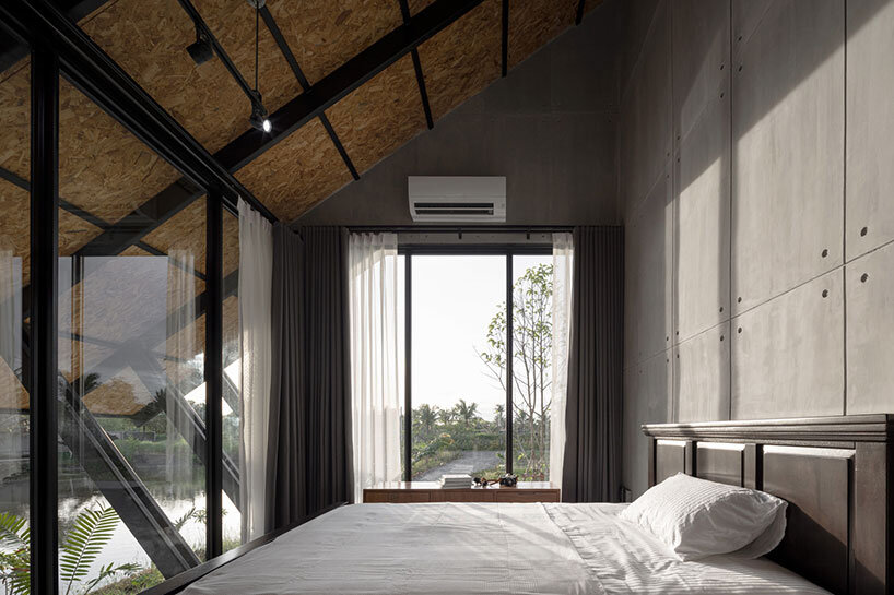 the sloping roof of TOUCH architect's 'villa backyard' directs rainwater in thailand