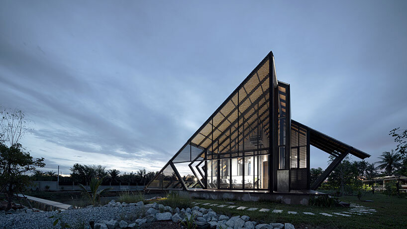 the sloping roof of TOUCH architect's 'villa backyard' directs rainwater in thailand