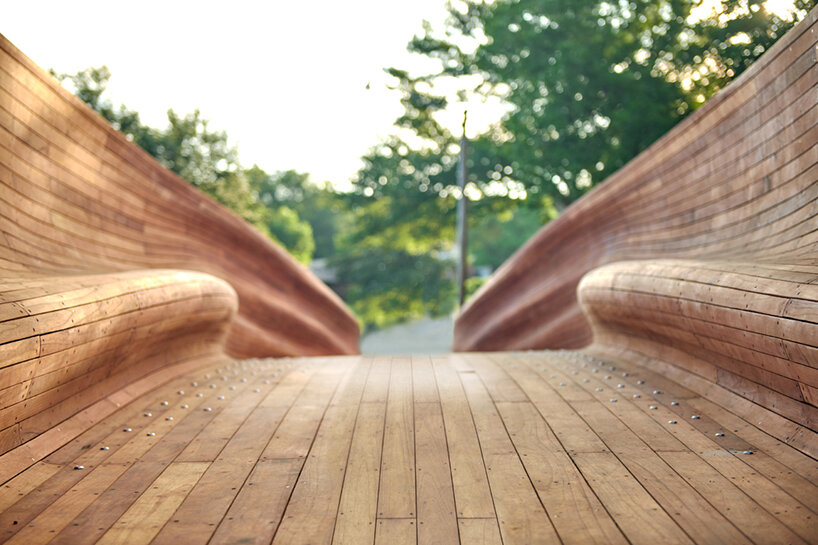 volkan alkanoglu takes cues from shipmaking to build undulating timber 'drift' bridge