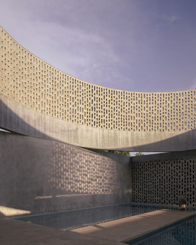 arkham projects wraps its wóolis house courtyard in a concrete lattice screen