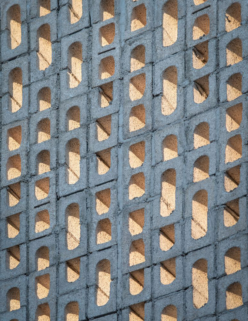 arkham projects wraps its wóolis house courtyard in a concrete lattice screen