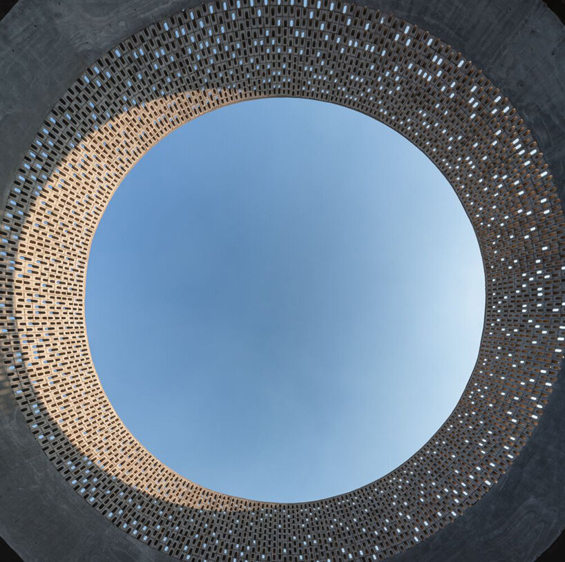 arkham projects wraps its wóolis house courtyard in a concrete lattice screen