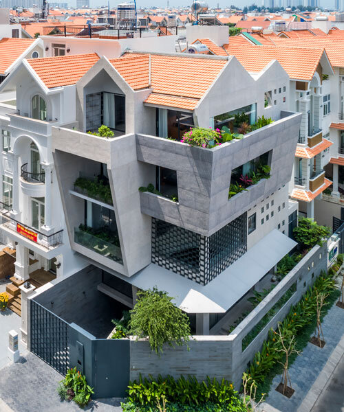 23o5studio interrupts a suburban block in vietnam with sloping concrete J14 house