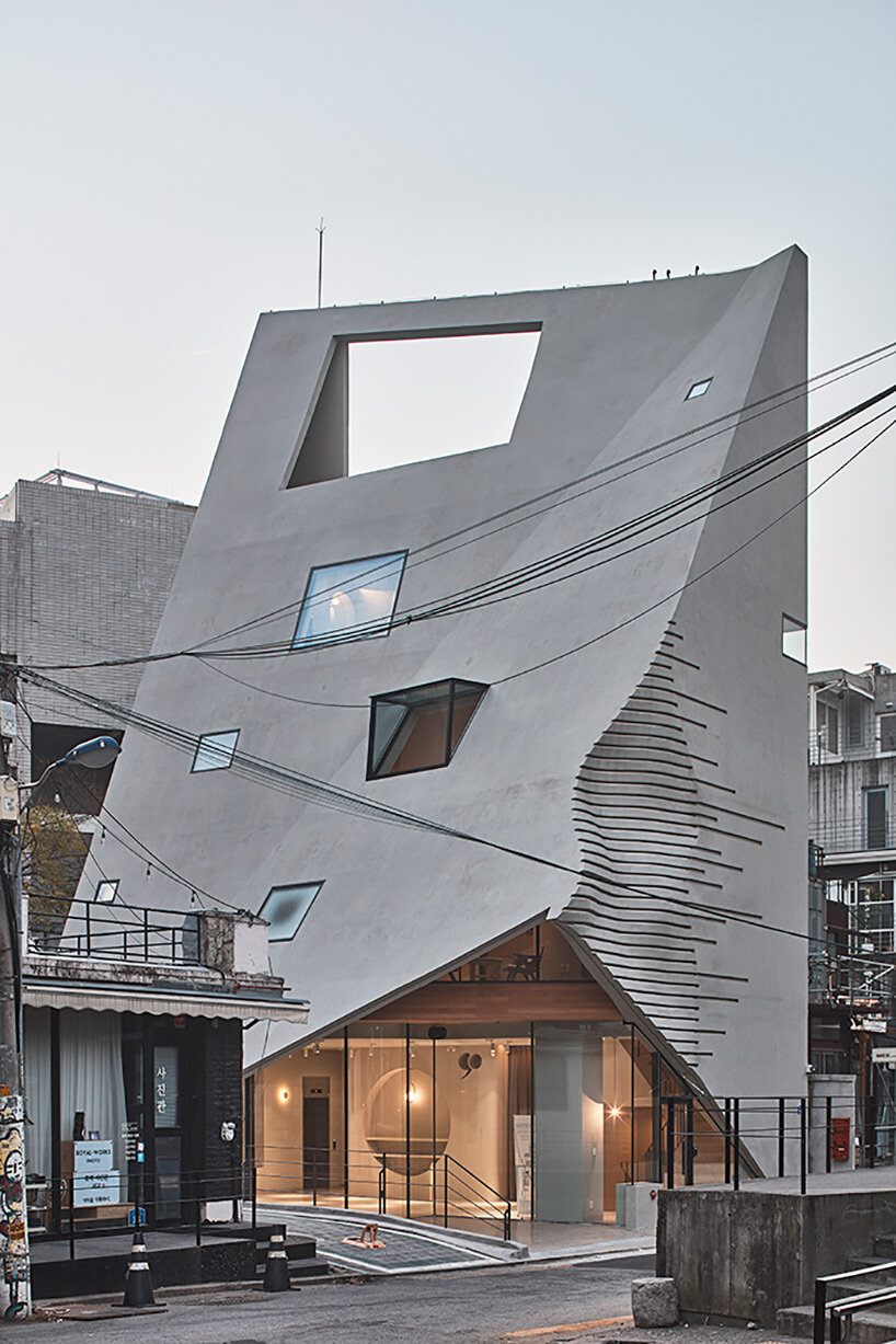 concrete pyramidoid spa by chiasmus stands out in the dense urban fabric of seoul