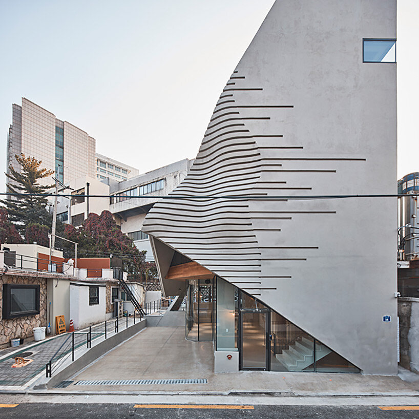 concrete pyramidoid spa by chiasmus stands out in the dense urban fabric of seoul
