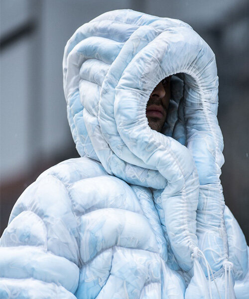 coat-19 is an icy blue puffer jacket stuffed with used facemasks