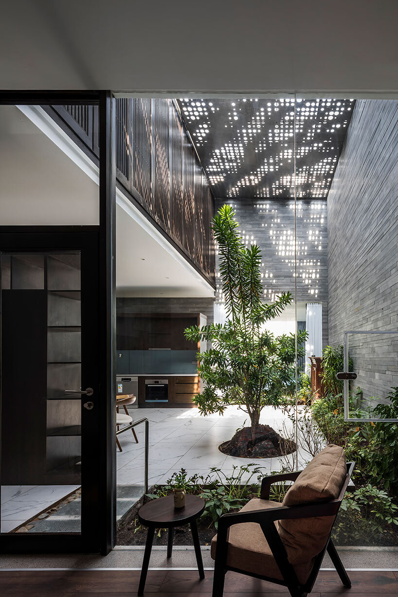 23o5studio's huy house is an oasis with delicately patterned sunlight