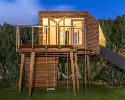 madeiguincho perches it's cassiopeia treehouse atop a set of timber stilts
