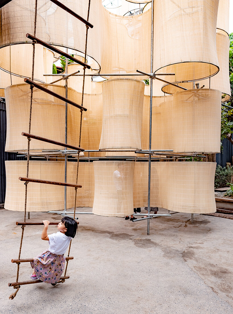 the sculptural pavilion brings vietnam's ancient industrial zone to life, inviting visitors to stroll and explore