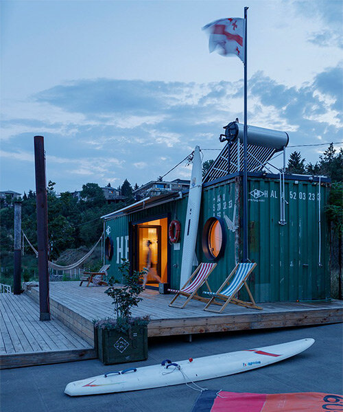 steel shipping container is transformed into relaxing getaway by the tbilisi sea, in georgia