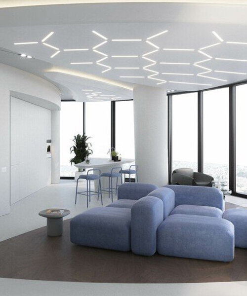 white convex walls dominate the interior of a futuristic apartment in tbilisi, georgia