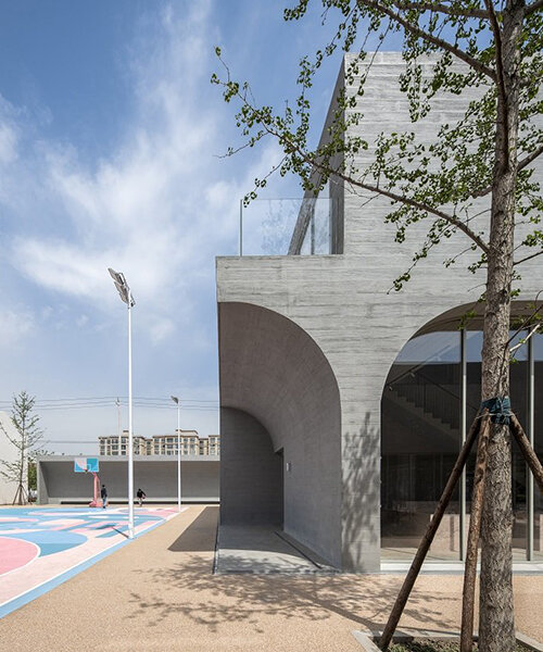 abstracted concrete arches dominate the qinchang village town hall in china