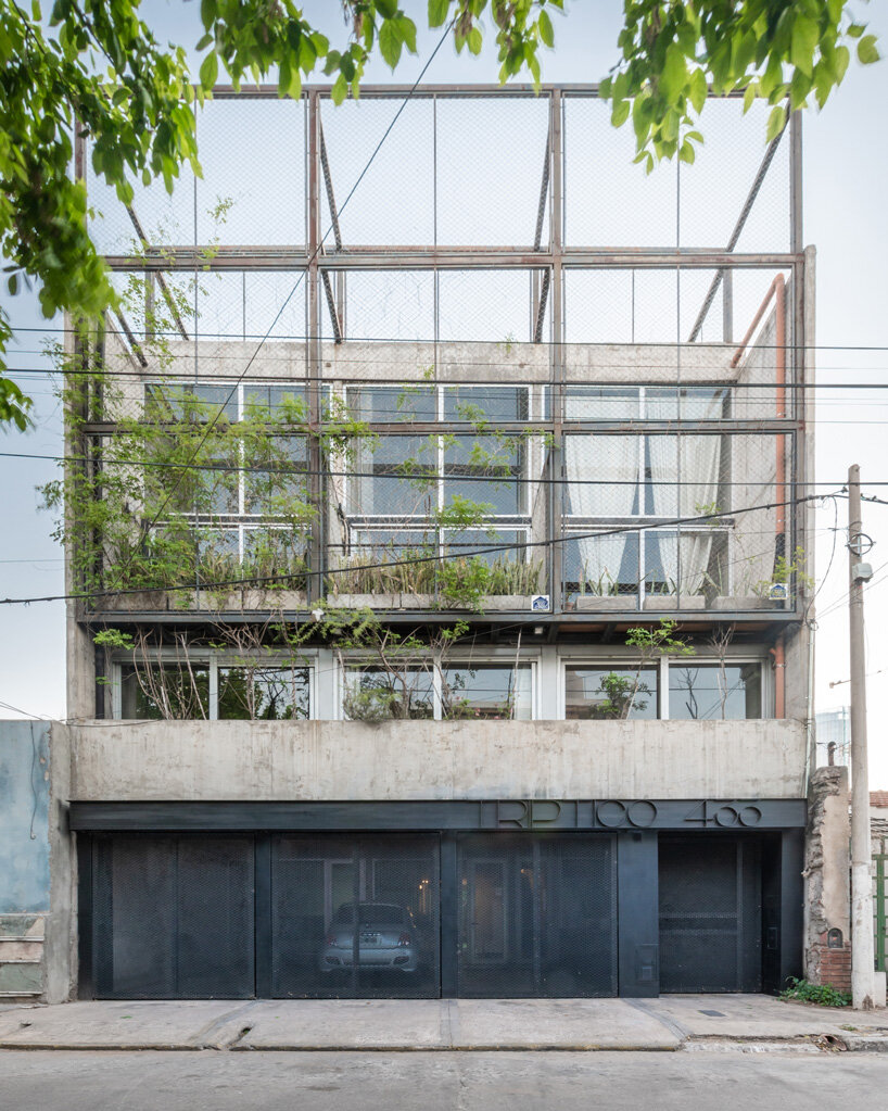 three vertical houses compose concrete 'triptico' building in córdoba, argentina