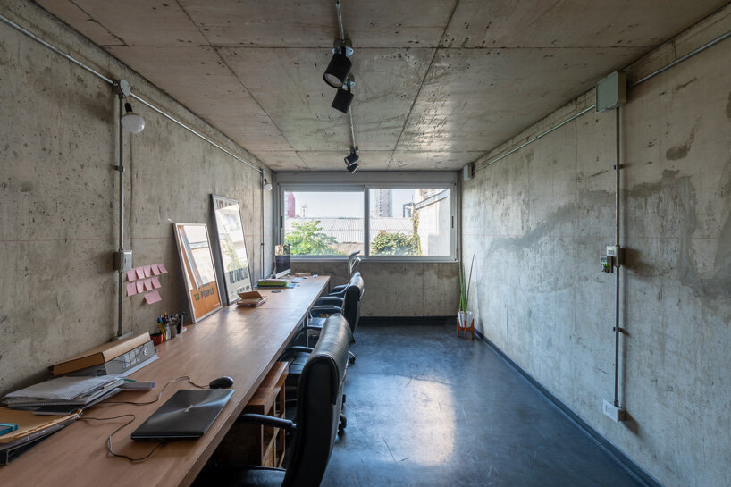 three vertical houses compose concrete 'triptico' building in córdoba, argentina