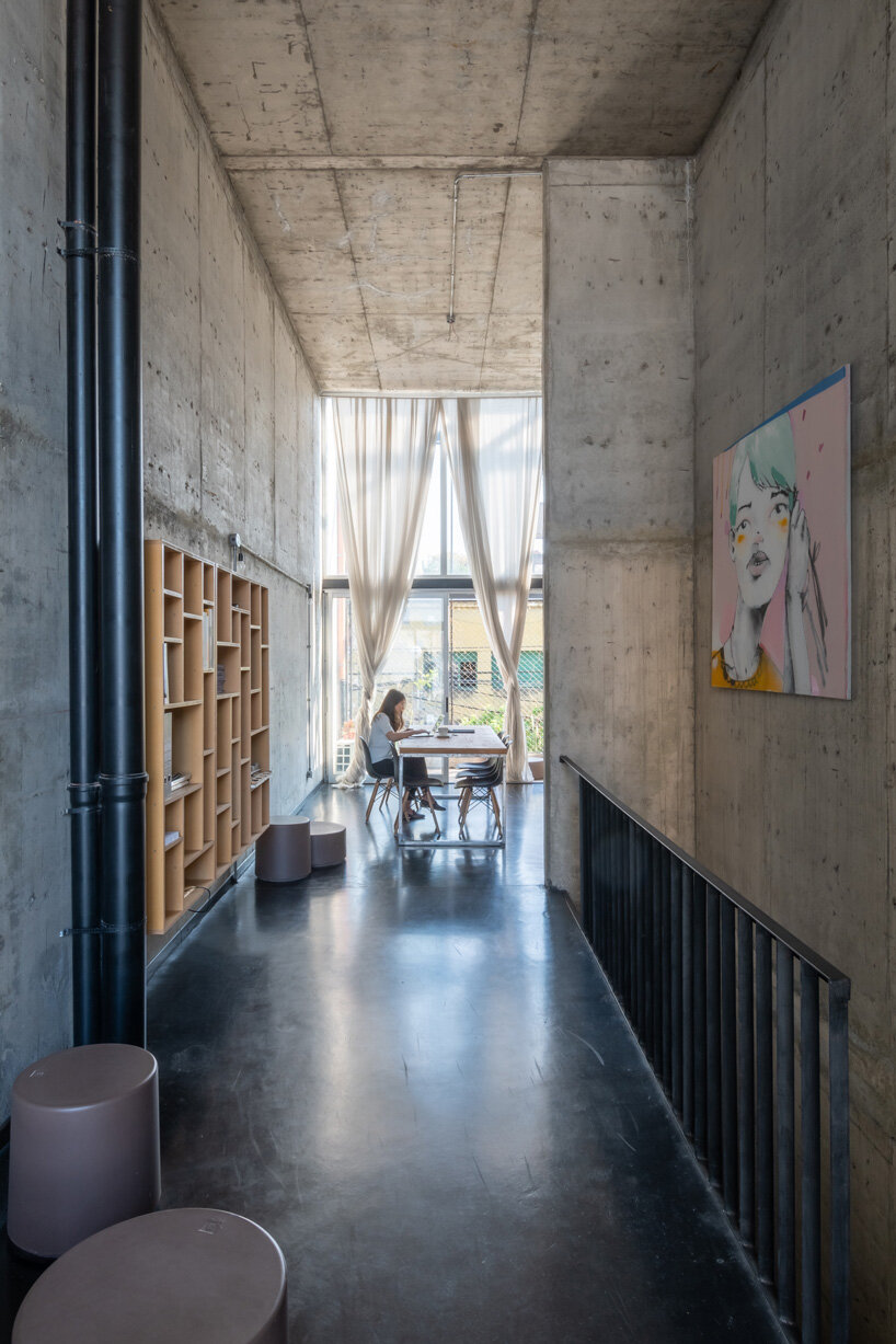 three vertical houses compose concrete 'triptico' building in córdoba, argentina