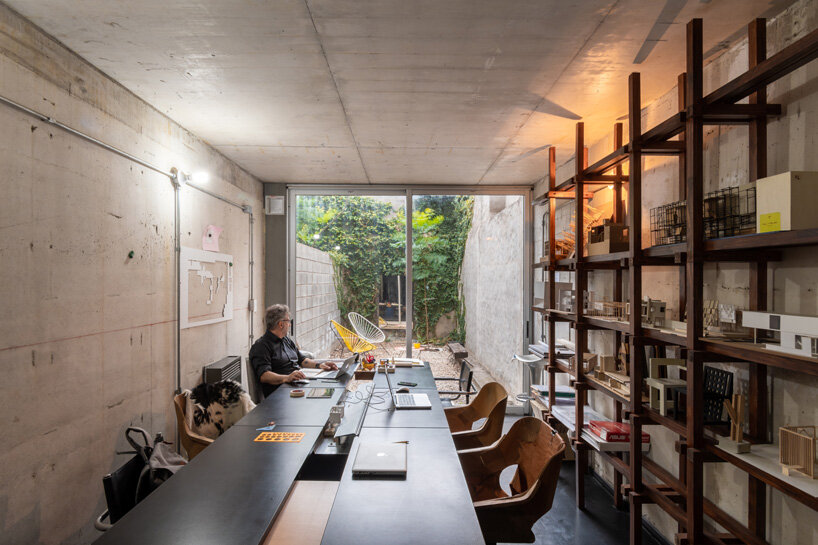 three vertical houses compose concrete 'triptico' building in córdoba, argentina